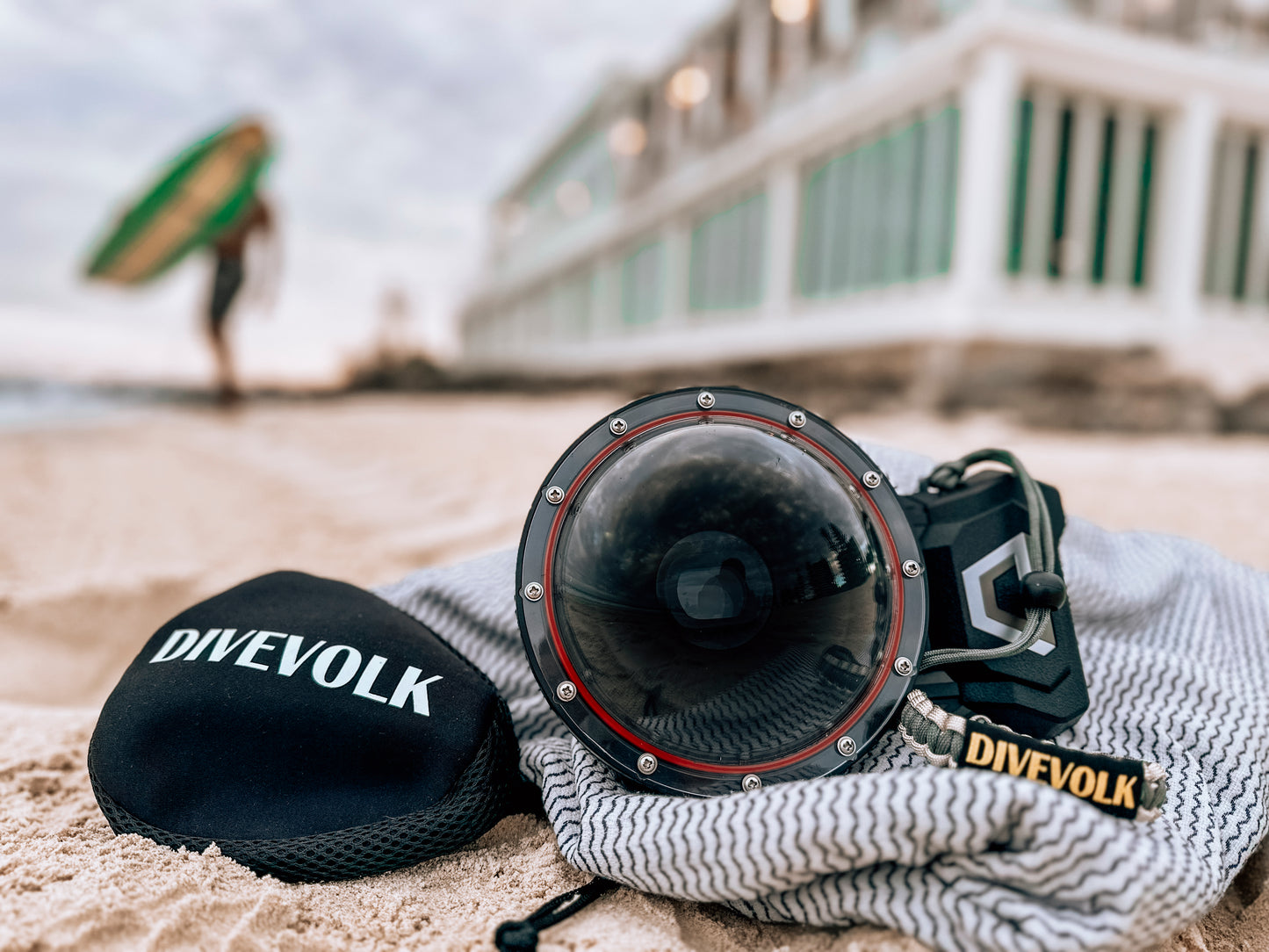 The Divevolk Seatouch 4 Max Smartphone Housing situated on the beach with the Dome lens installed