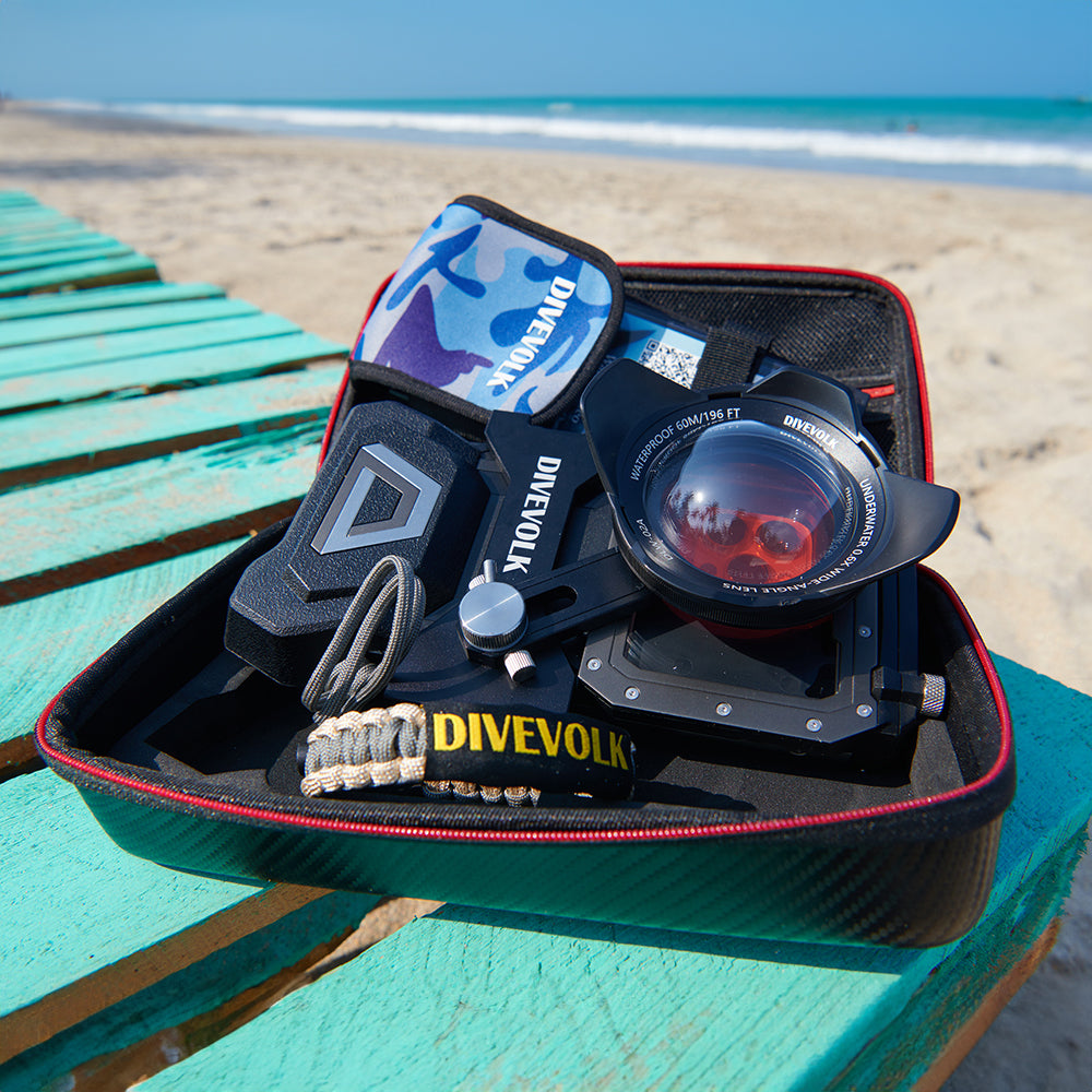 Divevolk diving equipment set on a teal table with a beach background