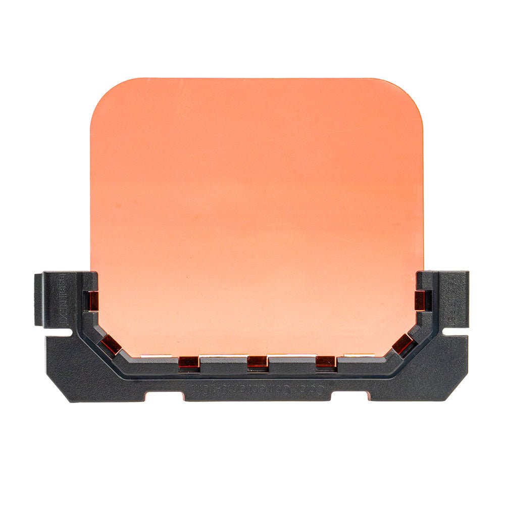 A rectangular orange-tinted camera housing lens filter with a black plastic mounting frame, shown against a solid white background.