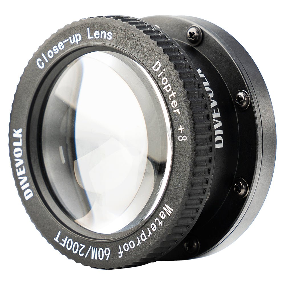 Close - up lens with Divevolk branding on a white background